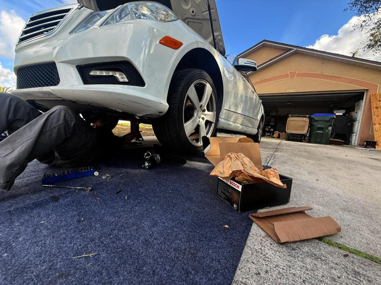 Mobile mechanic performing routine maintenance